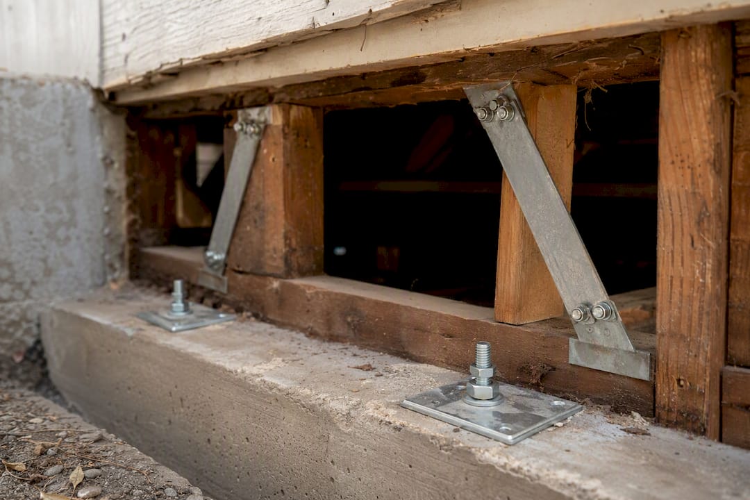 Close-up of seismic retrofit bolts and braces